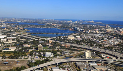 Fototapeta premium Aerial view of Clear Lake in downtown West Palm Beach, Florida, and the surrounding business district, as well as the I-95 expressway.