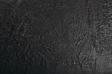 Dark grunge textured wall closeup