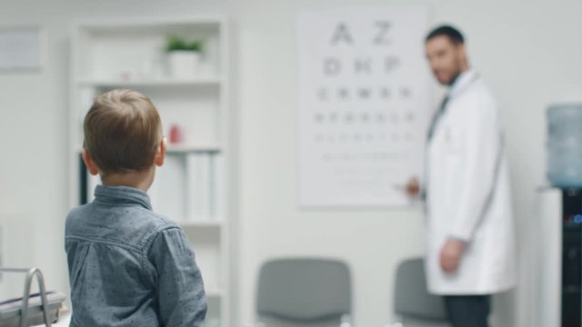 Young Boy is Checking His Eyesight in a Doctor's Office. room on a Boy.  Shot on RED Cinema Camera in 4K (UHD).