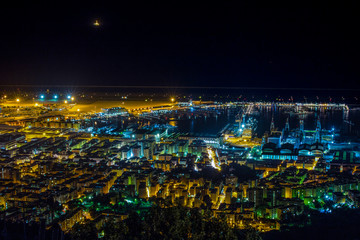 GENOA, ITALY - NOVEMBER 18, 2015 - Night view of Genoa city center, buildings, skyscrapers and sea in Genoa