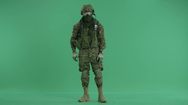 Soldier crossing hands at green screen