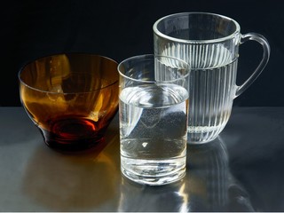 glasses and glass dishware on black background