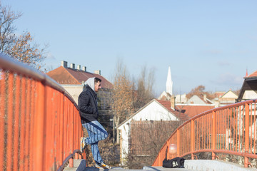 Man leaning on the fence and smiling