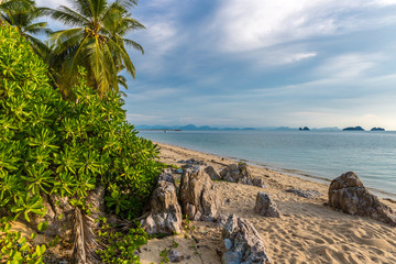 Fototapeta na wymiar THAILAND, Jule - 12, 2014. The sea, rocky beach and tropical plants in Koh Samui