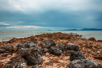 Fototapeta na wymiar THAILAND, Jule - 12, 2014. Coral Beach on a cloudy day in Koh Samui