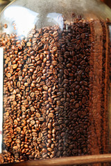Obraz premium coffee beans in glass container
