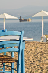 Details of a restaurant on a beach in Greece