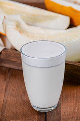 Melon smoothie on a wooden table