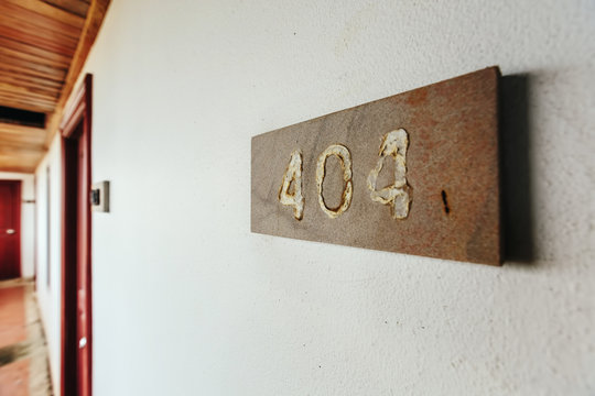Error 404 number plate in abandoned building on the old wall