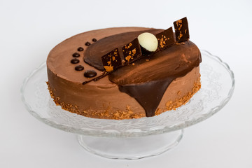 Chocolate ake on a glass stand
