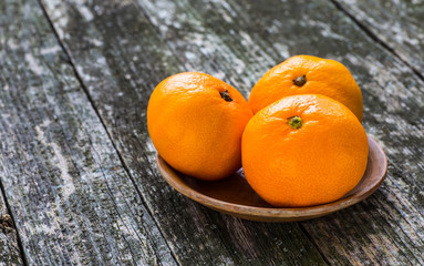 Fresh oranges on a wooden table