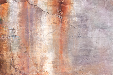 old plaster wall with stains from water and cracks