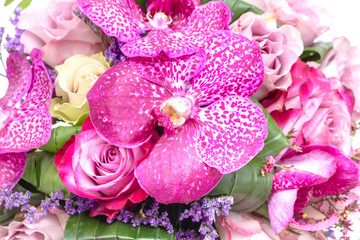Obraz premium Wedding bouquet made of pink roses and orchids
