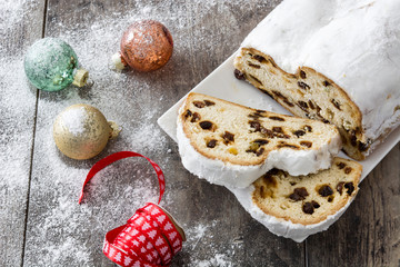 Christmas stollen. Traditional German Christmas dessert on wooden background
