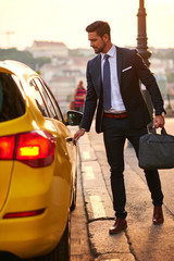 Young businessman with a taxi
