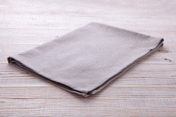Napkin tablecloth on white wooden table. Empty napkin template. Unique perspectives horizontal.