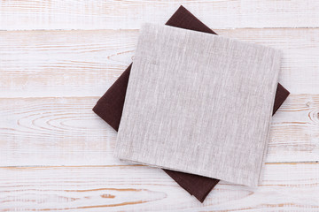 Napkin. Cloth napkin, tablecloth on white wooden background. Top view, mockup.