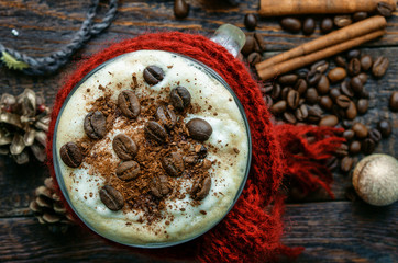 Coffee with cinnamon on christmas decorations. Top view