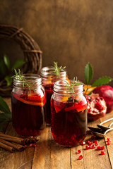 Fototapeta na wymiar Pomegranate and orange winter cocktail