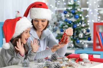 Mother and daughter preparing for Christmas