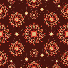 Fototapeta na wymiar Snowflakes and stars on a dark brown background. Seamless pattern. Design for textiles, tapestries, napkins, wrapping paper.