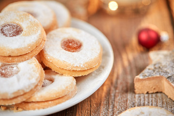 Christmas cookies and red balls on table