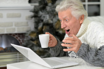 Senior man with laptop