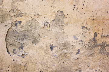 Cracked concrete vintage wall background,old dry damaged wall. Texture of old plaster wall rusty old-fashioned with space for your design. Grunge wall of the old house abstract horizontal.