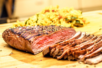 Beef dinner delicious and perfect grilled stake with pepper, risotto and vine. Black Angus, risotto and vine.