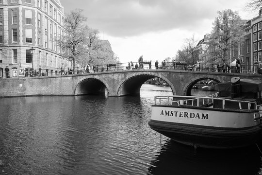 Amsterdam, Naterland - APRIL 11, 2014:  A Boat mooring on the ri