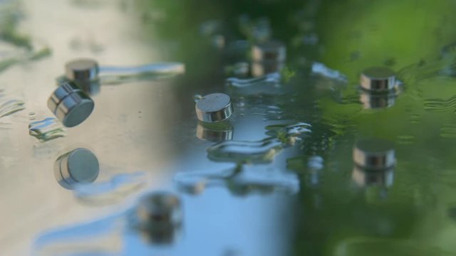 Magnets bounce and join together in slowmotion (B)