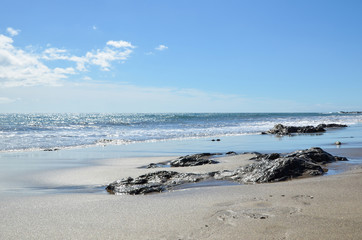 Glittering water at a sand beach
