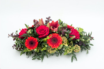 colorful flower arrangement wreath for funerals isolated on white