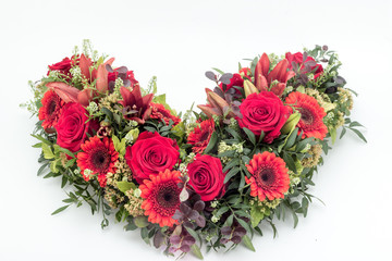 colorful flower arrangement wreath for funerals isolated on white