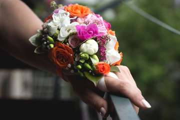 Wedding bouquet in hands of the bride