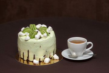 Green pistachio cake with macaroons and marshmallows