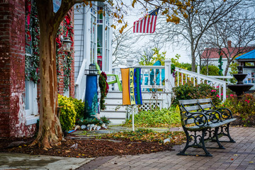 Bench and businesses on Main Street, in Chincoteague Island, Vir