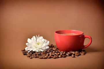 still life. warm cup of coffee on brown background. Dramatic interpretation. Low key, dark background, spot lighting, and rich Old Masters colors.