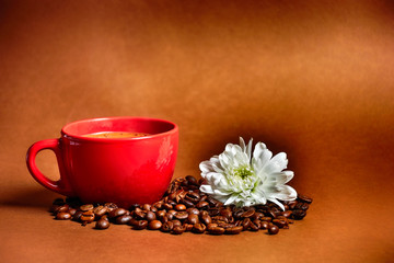still life. warm cup of coffee on brown background. Dramatic interpretation. Low key, dark background, spot lighting, and rich Old Masters colors.