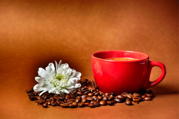 still life. warm cup of coffee on brown background. Dramatic interpretation. Low key, dark background, spot lighting, and rich Old Masters colors.