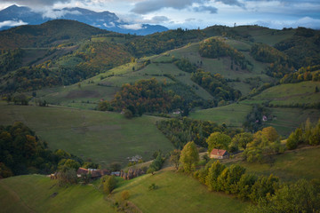 Fototapeta premium Evening sunset on mountain hills of Simon village. Bran.