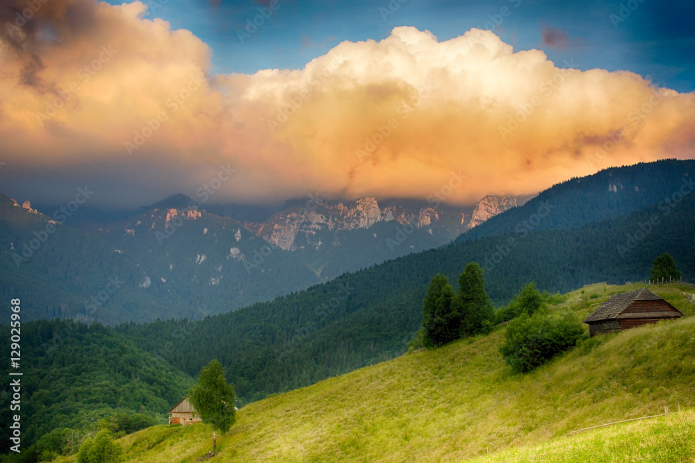 Wall mural evening, sunset on mountain hills of simon village. bran.