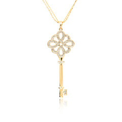 Fototapeta na wymiar Golden diamond key pendant isolated on white
