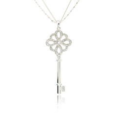 Fototapeta na wymiar Silver diamond key pendant isolated on white