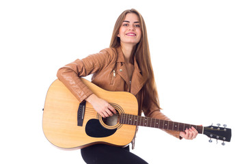 Fototapeta premium Young woman holding a guitar 