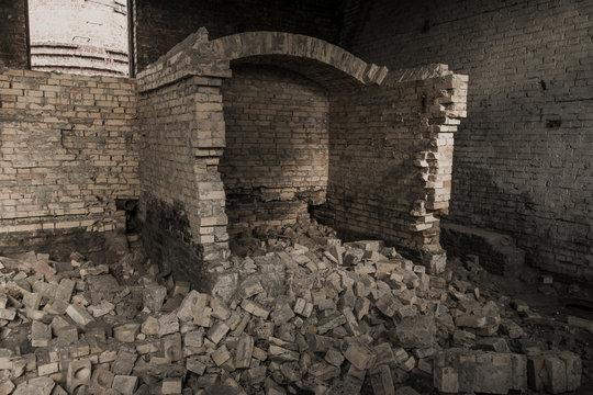 destroyed the furnace in an abandoned building. boiler room. a lot of old bricks is a bunch.