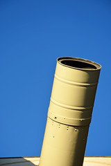 Telescope closeup with blue sky background