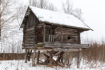 Traditional rural wooden house in winter