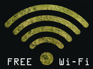 Free WIFI sign with grass visible through graphics 