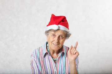 Old woman in the hat of a santa claus